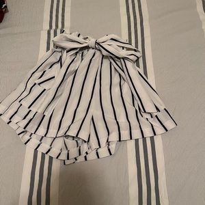 White shorts with black stripes, tie in front